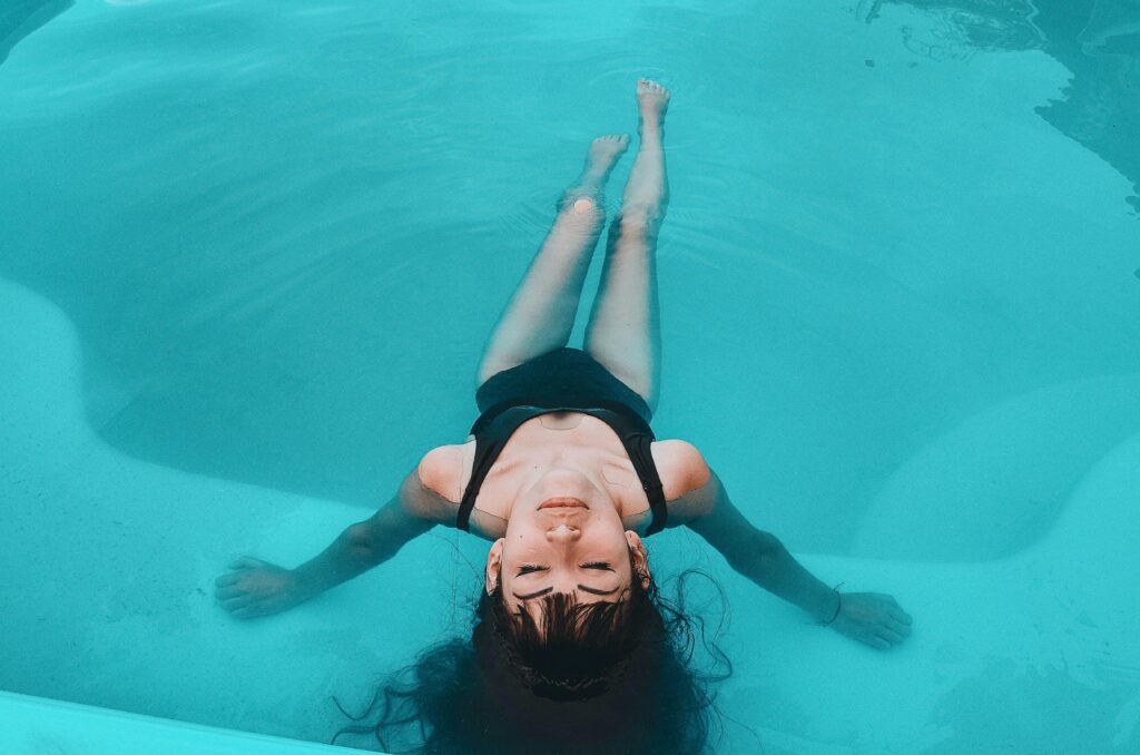 pexels-photo-4635389-4635389 Woman in Black Tank Top in Water